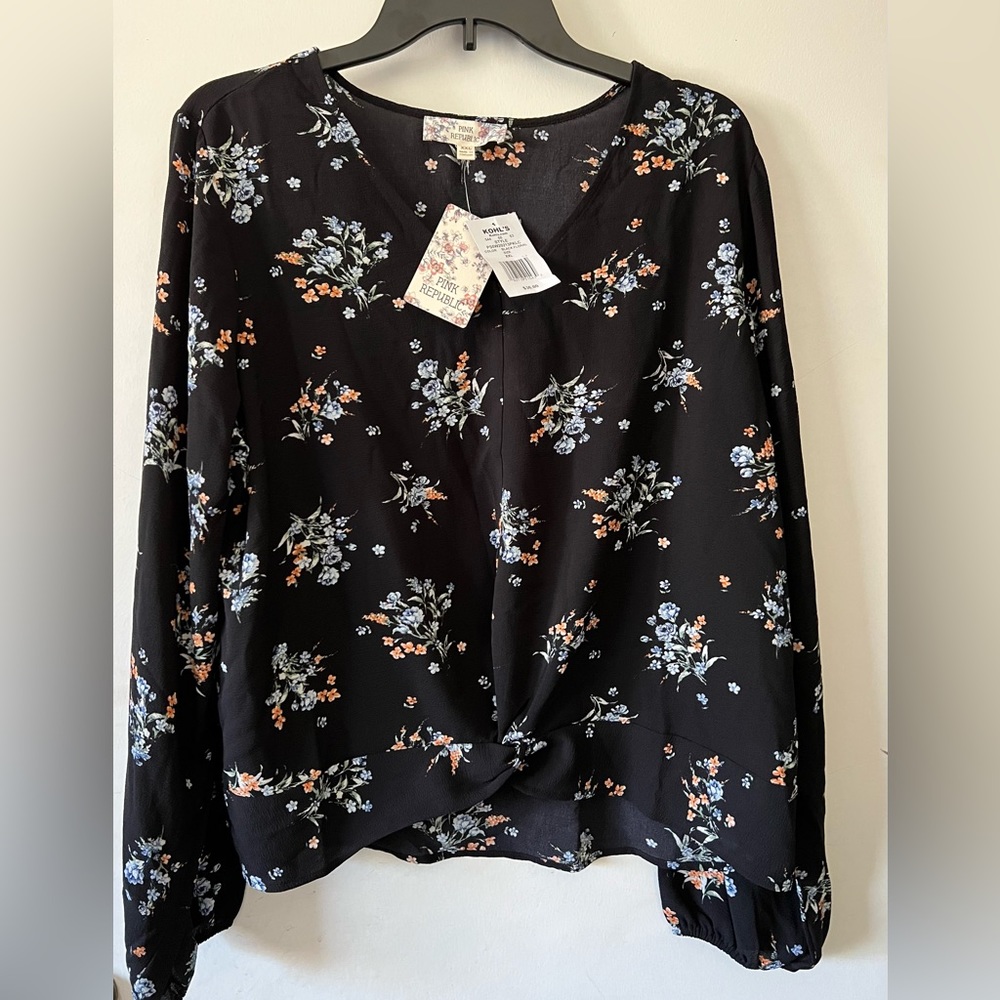 NWT beautiful black floral blouse length 23inch by width 23 inch.